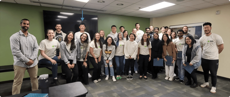 Usabilathon 2022 participants gathered in a GMU classroom — an arrow marks Chevis in the back row